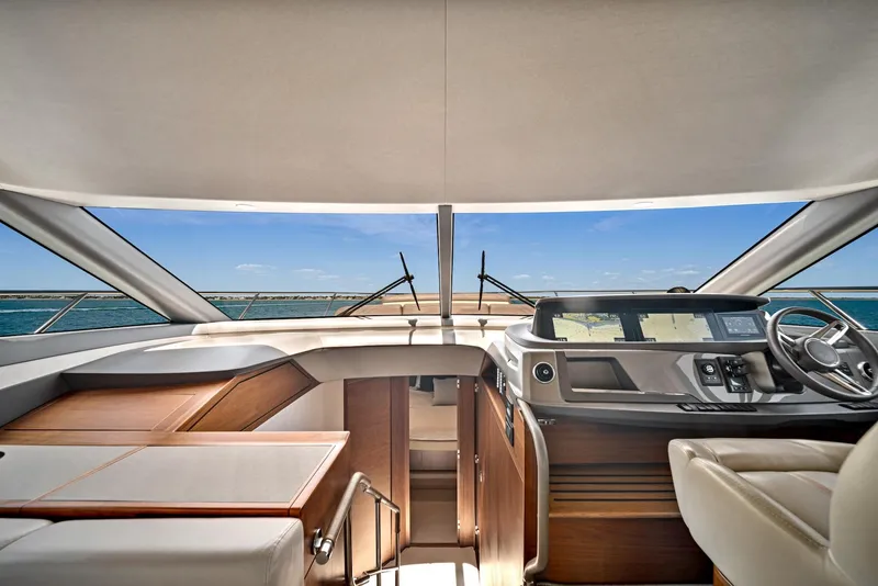 Slide: The Image of Interior view of 2020 Princess F55 Flybridge yacht with ocean backdrop. - 17