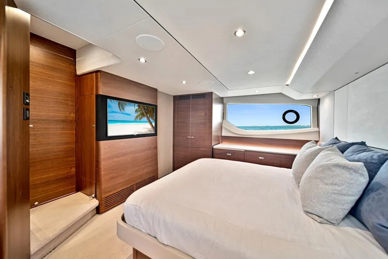 Slide: The Image of Luxurious bedroom interior of 2020 Princess F55 Flybridge yacht with ocean view. - 23