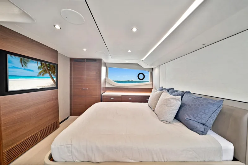 Slide: The Image of Luxurious bedroom interior of 2020 Princess F55 Flybridge yacht with ocean view. - 24