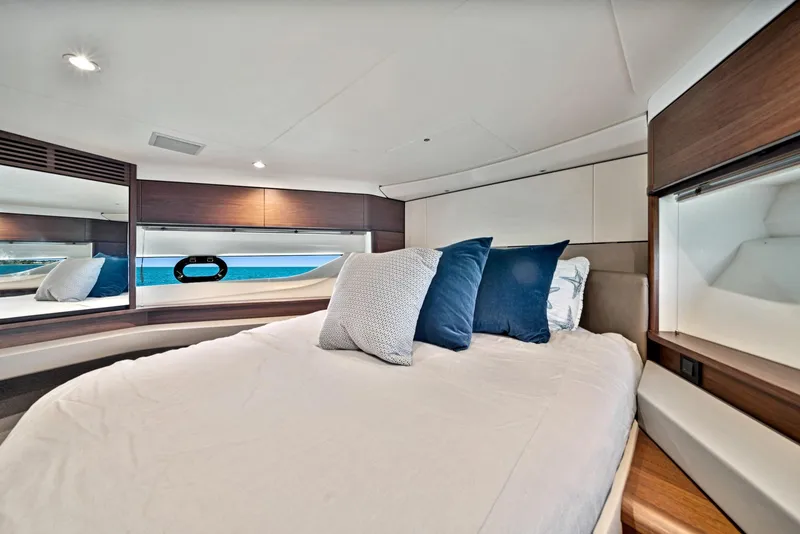Slide: The Image of Luxurious bedroom interior of 2020 Princess F55 Flybridge yacht with ocean view. - 25