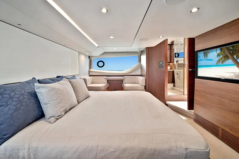 Slide: The Image of Luxurious bedroom interior of 2020 Princess F55 Flybridge yacht with ocean view. - 26