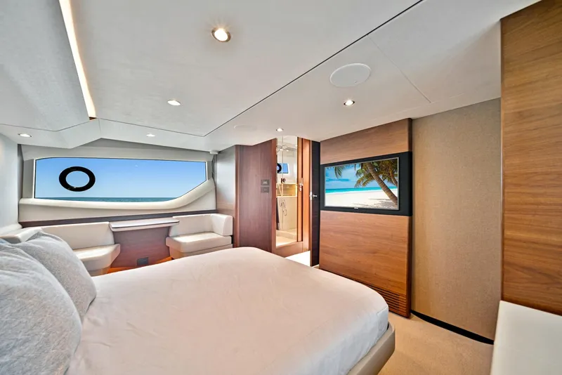 Slide: The Image of Luxurious bedroom interior of 2020 Princess F55 Flybridge yacht with ocean view. - 28