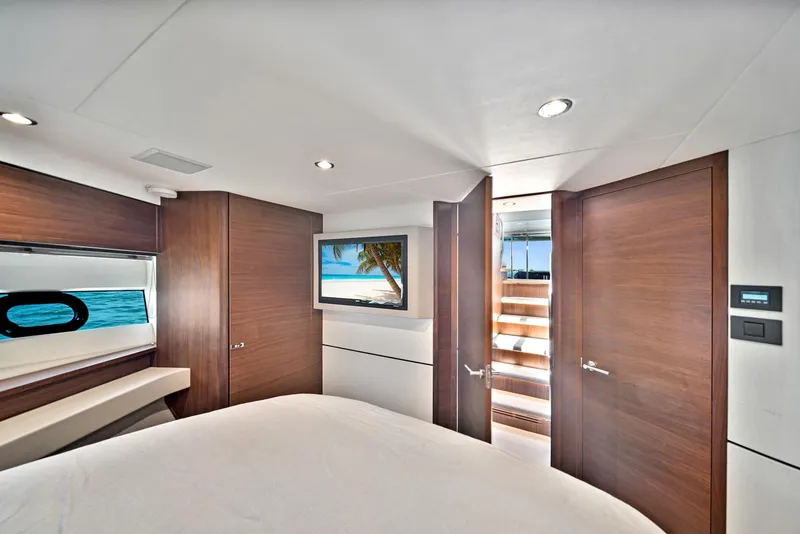 Slide: The Image of Luxurious bedroom interior of 2020 Princess F55 Flybridge yacht with modern amenities. - 29