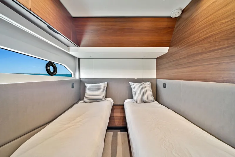 Slide: The Image of Twin beds in the 2020 Princess F55 Flybridge yacht cabin. - 35