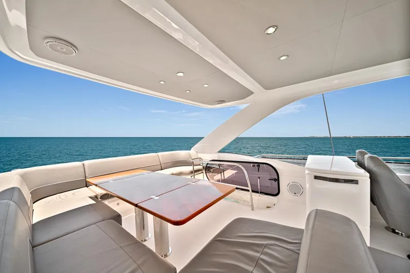 Slide: The Image of Flybridge seating area on a 2020 Princess F55 yacht with ocean view. - 38