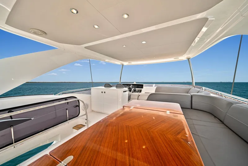 Slide: The Image of 2020 Princess F55 Flybridge yacht with luxurious seating and ocean view. - 40