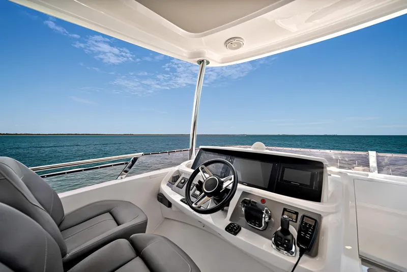 Slide: The Image of Flybridge helm of 2020 Princess F55 yacht with ocean view. - 43