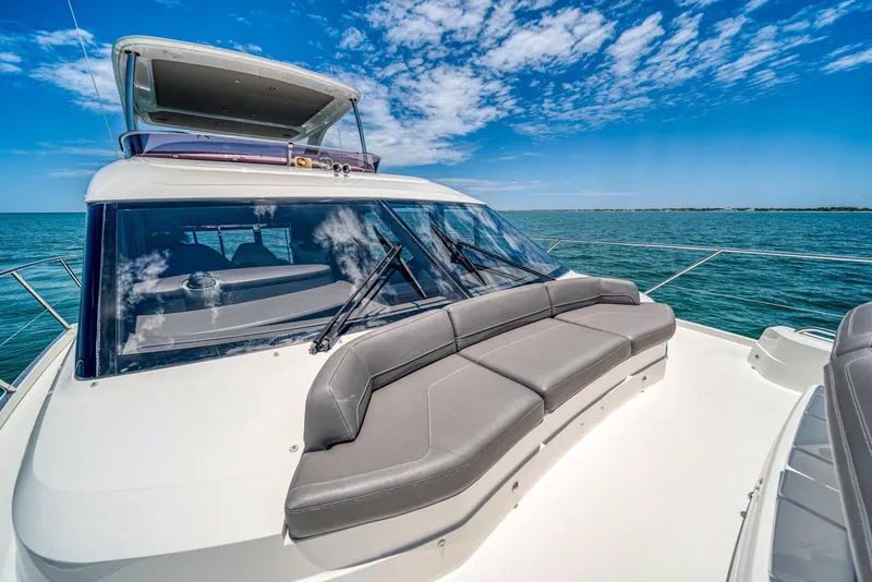 Slide: The Image of 2020 Princess F55 Flybridge yacht with luxurious seating on the deck. - 49
