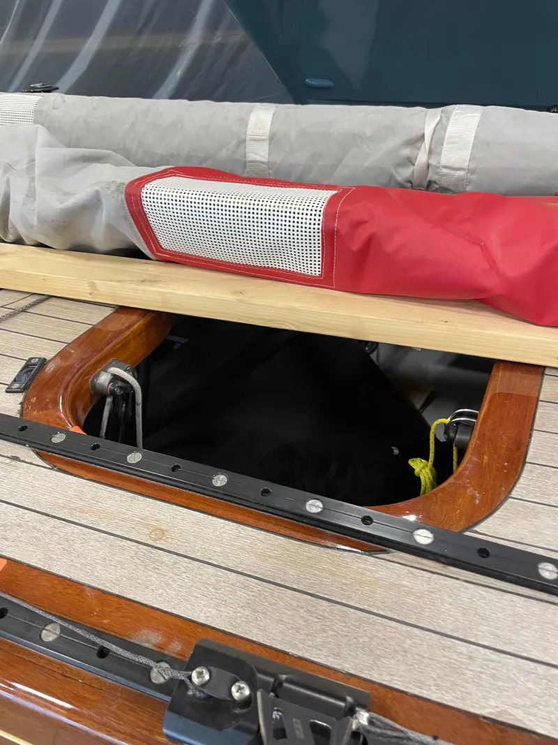 Slide: The Image of Hatch on 1989 Litton International 6 Metre sailboat with stored sails on deck. - 5