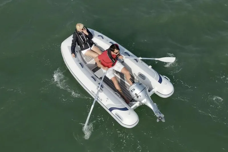 Slide: The Image of 2025 Highfield Classic 310 inflatable boat, top view, gray and white design. - 2