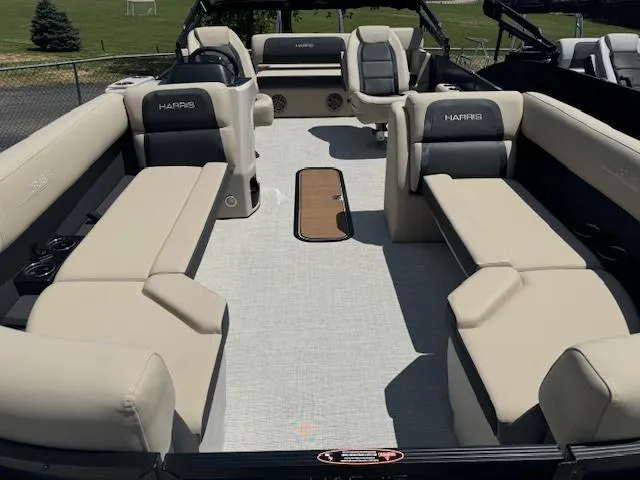 Slide: The Image of 2024 Harris FloteBote 230 Cruiser SLDH pontoon boat with spacious seating and modern design. - 2