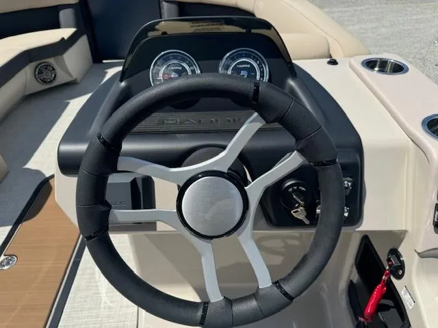 Slide: The Image of 2024 Harris FloteBote 230 Cruiser SLDH steering wheel and dashboard. - 4