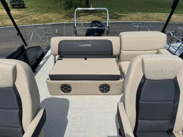 Slide: The Image of 2024 Harris FloteBote 230 Cruiser SLDH interior with beige and gray seating. - 9