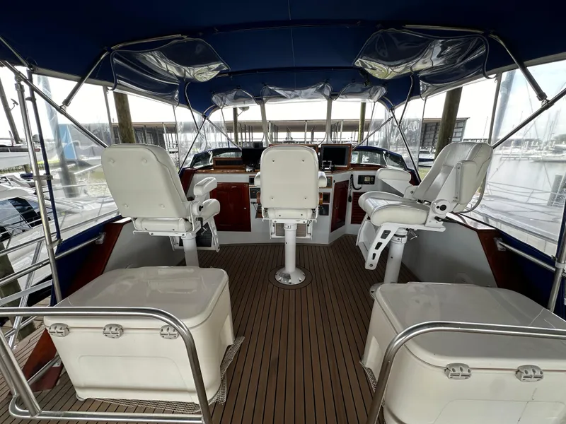 Slide: The Image of Interior view of 1980 Bertram 58 Convertible Custom yacht cockpit with seating and controls. - 15