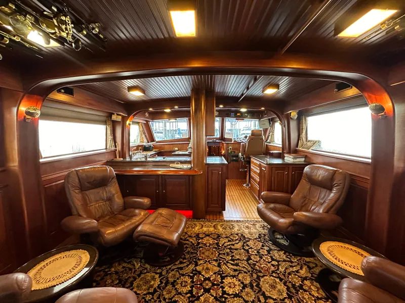 Slide: The Image of Luxurious Bertram 58 Convertible yacht interior with leather seating and elegant wood finishes, rebuilt in 2010. - 43