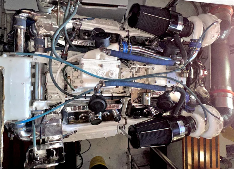 Slide: The Image of Engine of a 1980 Bertram 58 Convertible Custom boat, showcasing intricate mechanical components. - 30