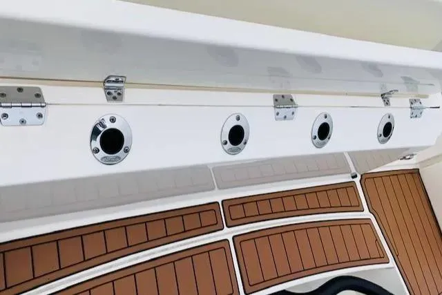 Slide: The Image of 2021 Cobia 330 Dual Console rod holders and deck view. - 11