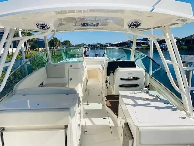 Slide: The Image of 2021 Cobia 330 Dual Console boat interior with seating and helm station. - 16