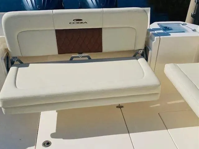 Slide: The Image of 2021 Cobia 330 Dual Console boat with fold-down seating. - 19