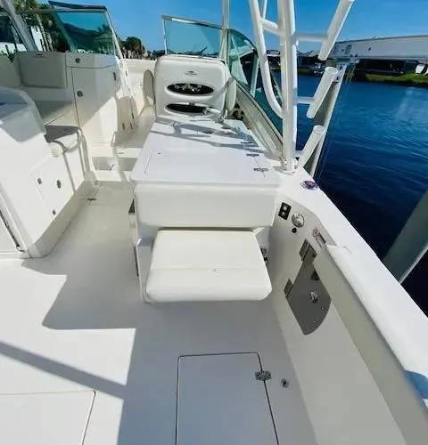 Slide: The Image of 2021 Cobia 330 Dual Console boat interior with seating and storage. - 37