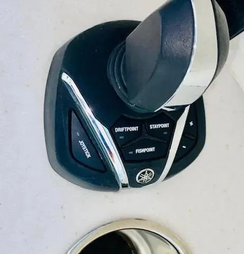 Slide: The Image of Joystick control on 2021 Cobia 330 Dual Console boat. - 40