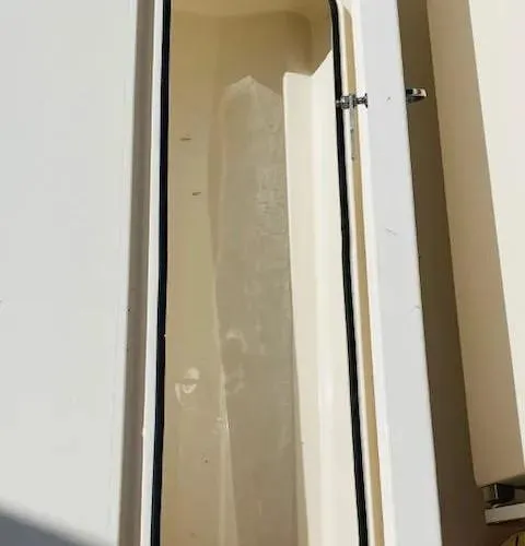 Slide: The Image of 2021 Cobia 330 Dual Console storage compartment. - 41