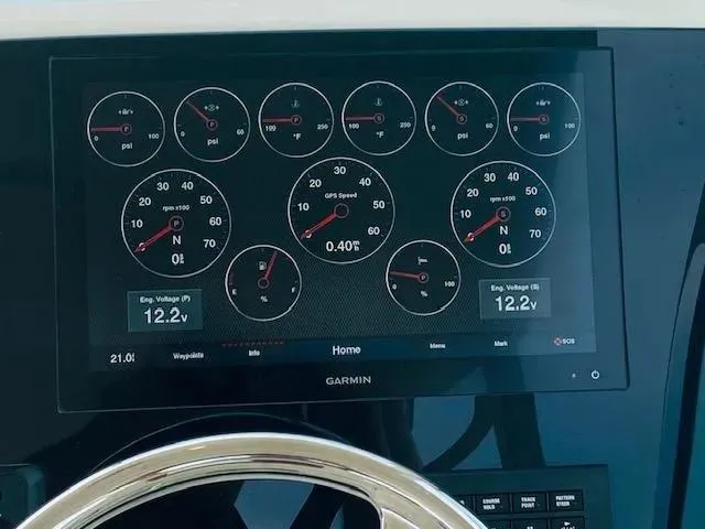 Slide: The Image of Garmin display on 2021 Cobia 330 Dual Console showing engine metrics and voltages. - 45