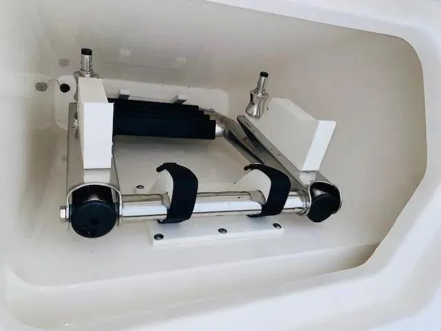 Slide: The Image of 2021 Cobia 330 Dual Console storage compartment with mounted equipment. - 7