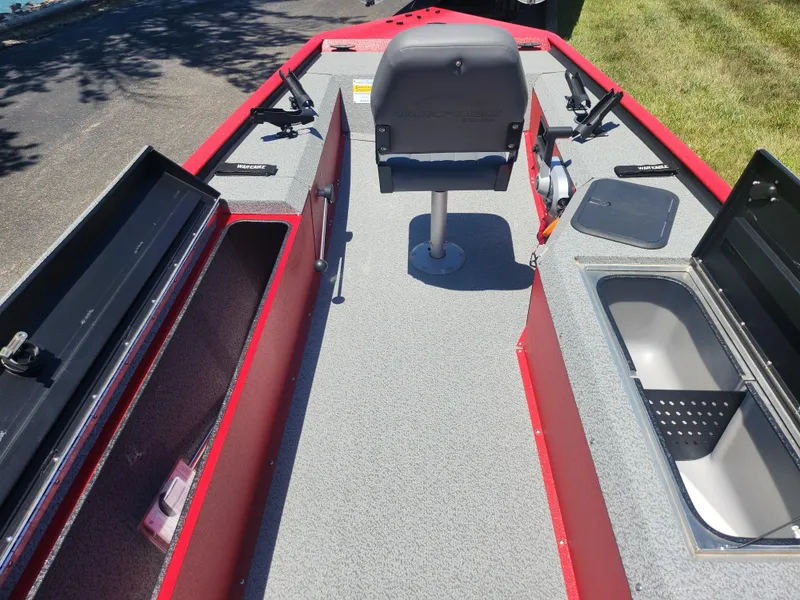 Slide: The Image of 2018 War Eagle 754VS Stick Steer boat interior with storage compartments and seating. - 12