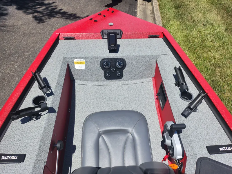 Slide: The Image of 2018 War Eagle 754VS Stick Steer boat interior with steering console and rod holders. - 13