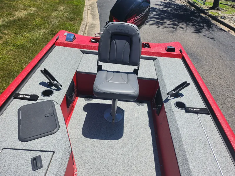 Slide: The Image of 2018 War Eagle 754VS Stick Steer boat with a central seat and fishing rod holders. - 16