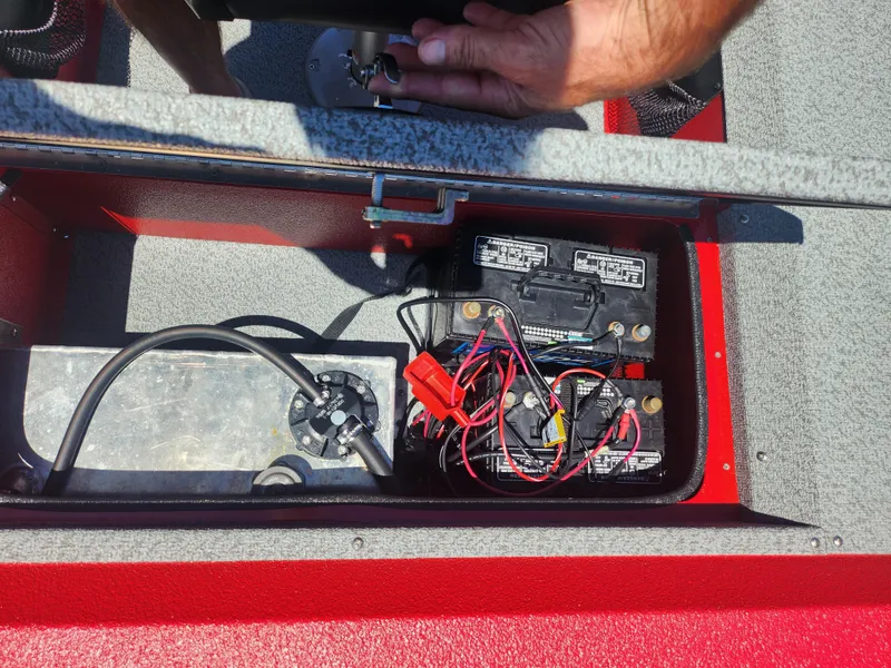 Slide: The Image of 2018 War Eagle 754VS Stick Steer boat battery compartment with wiring and components. - 18