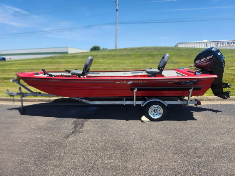 Slide: The Image of 2018 War Eagle 754VS Stick Steer boat on trailer with Mercury outboard motor. - 4