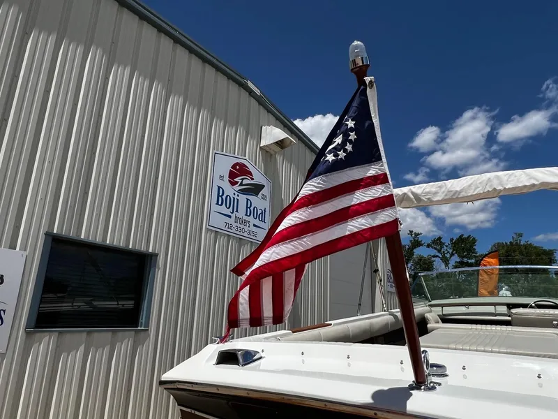 Slide: The Image of 1973 Century Coronado boat with American flag at Boji Boat Brokers. - 13