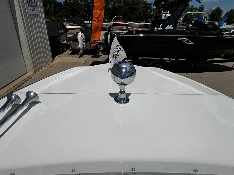 Slide: The Image of 1973 Century Coronado boat bow with chrome horn and flag at marina. - 15