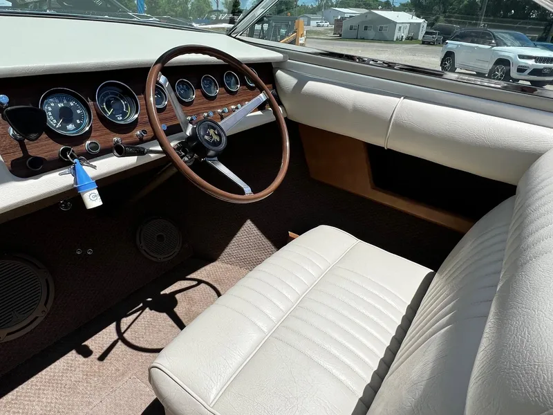 Slide: The Image of 1973 Century Coronado dashboard and steering wheel with classic wood paneling. - 16