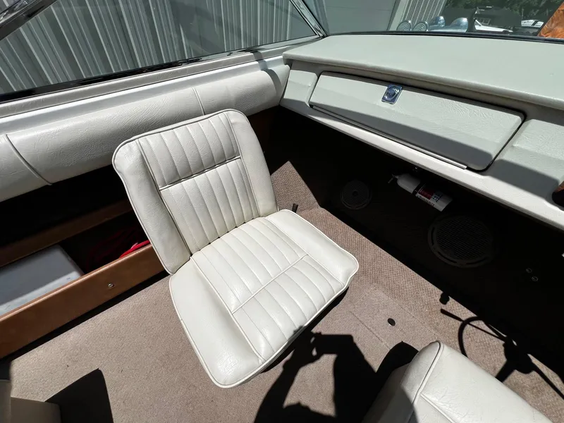 Slide: The Image of 1973 Century Coronado boat interior with white leather seats and beige carpet. - 17