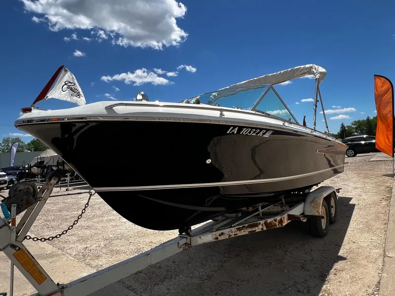 Slide: The Image of 1973 Century Coronado boat on trailer under blue sky. - 2