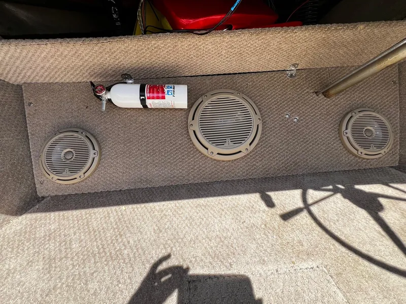 Slide: The Image of 1973 Century Coronado boat interior with speakers and fire extinguisher. - 21