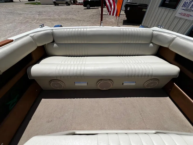 Slide: The Image of 1973 Century Coronado boat interior with white leather seating and built-in speakers. - 26