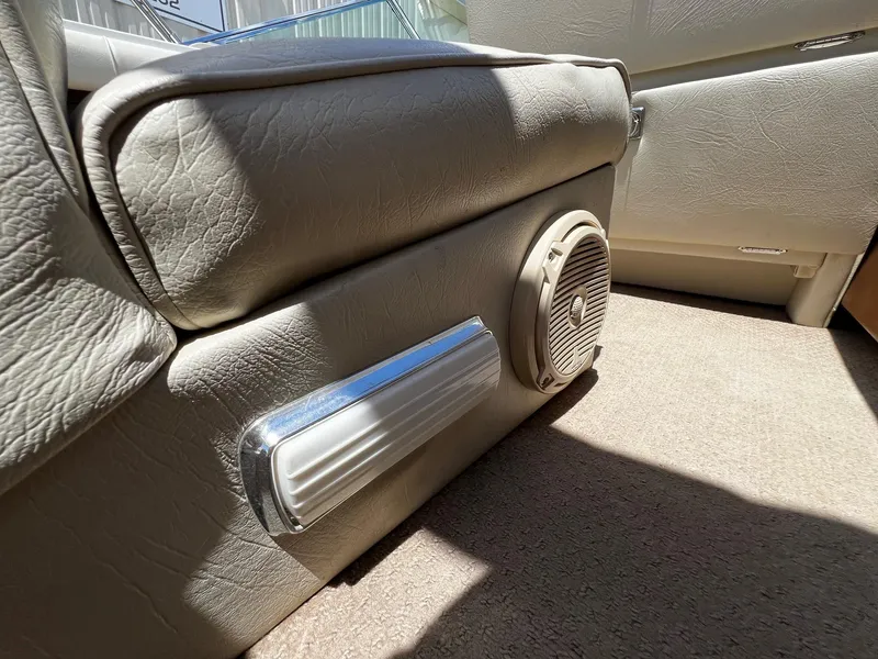 Slide: The Image of 1973 Century Coronado interior, beige leather seats, speaker, and chrome trim. - 27