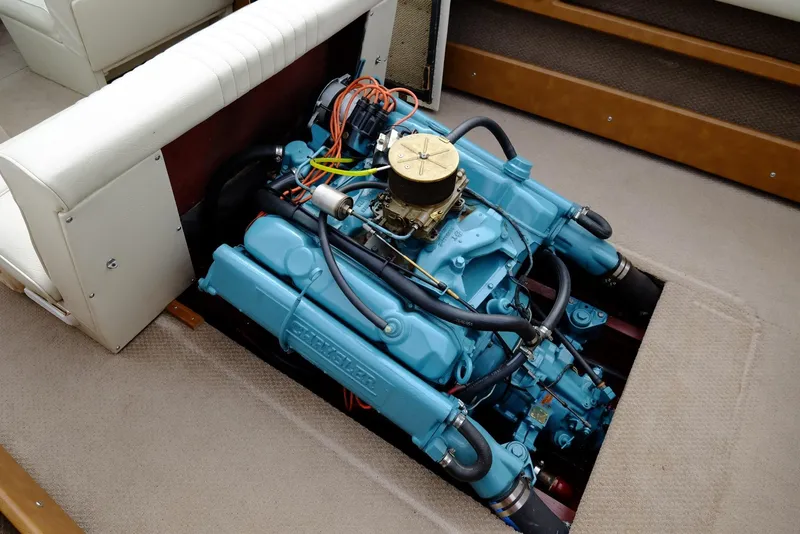 Slide: The Image of 1973 Century Coronado boat engine with blue Chrysler motor and beige interior. - 30