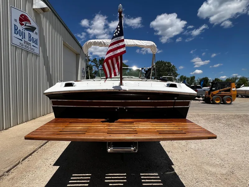 Slide: The Image of 1973 Century Coronado boat at Boji Boat Brokers with American flag. - 5