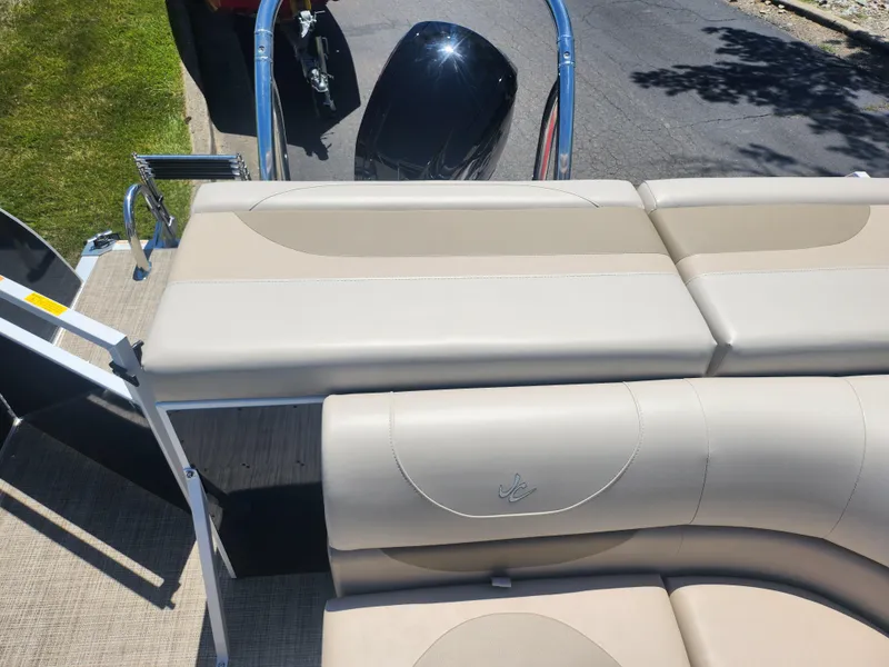 Slide: The Image of 2019 JC 222 Spirit boat with beige seating and outboard motor. - 14