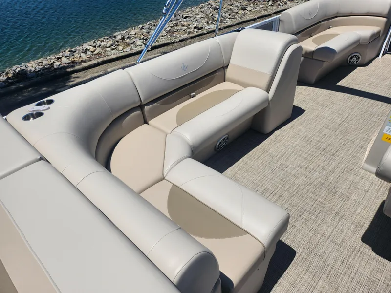Slide: The Image of 2019 JC 222 Spirit pontoon boat with beige seating and carpeted deck. - 17