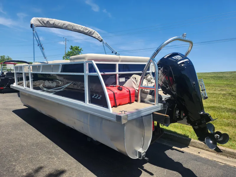 Slide: The Image of 2019 JC 222 Spirit pontoon boat with outboard motor on a sunny day. - 3