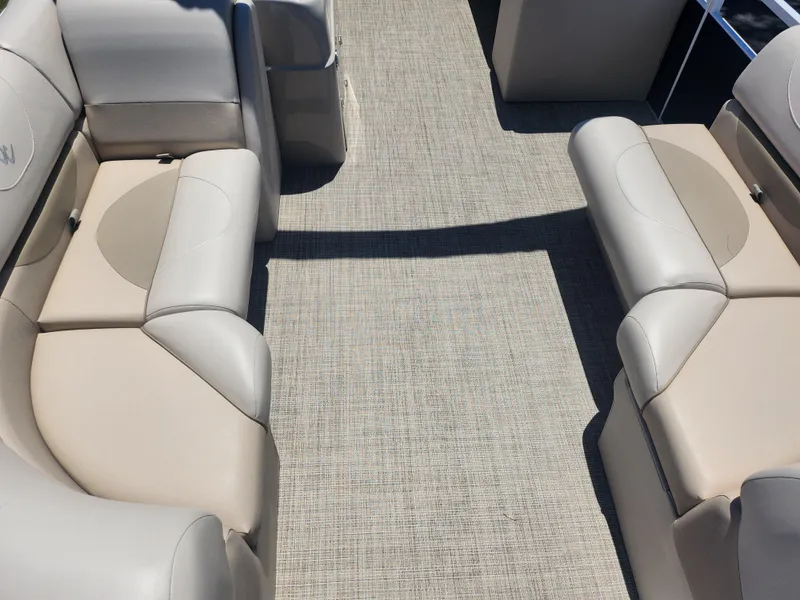 Slide: The Image of Interior seating of a 2019 JC 222 Spirit boat with beige upholstery. - 9