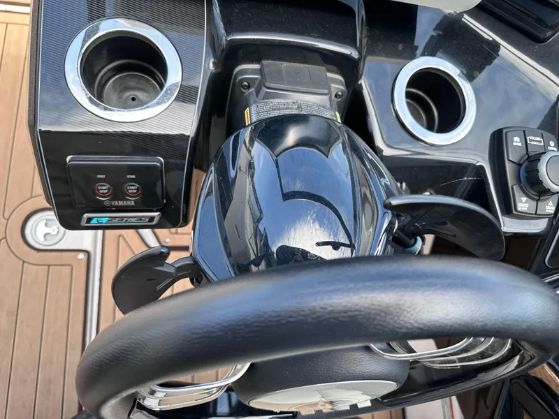 Slide: The Image of Close-up of the 2021 Yamaha Boats 252 SD steering wheel and control panel. - 17