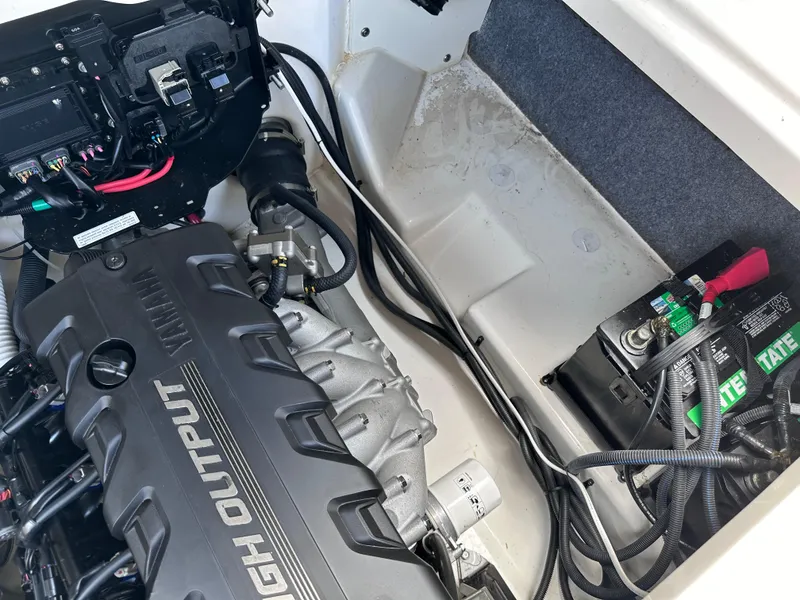 Slide: The Image of Yamaha Boats 2021 252 SD engine compartment with high output engine and battery. - 28