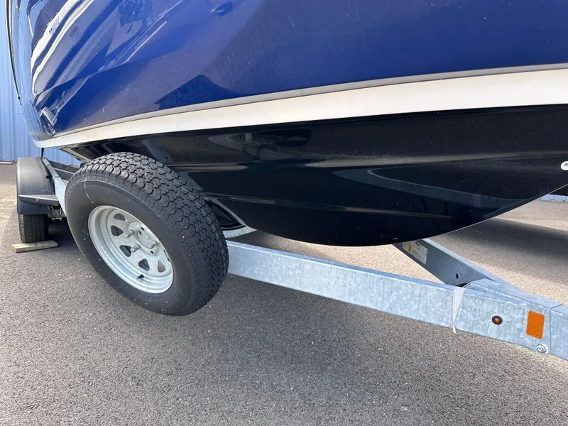 Slide: The Image of Close-up of a 2021 Yamaha Boats 252 SD on a trailer. - 3